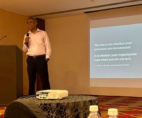 Frank Compressors Special Moments - speaker with mic presenting at company event
